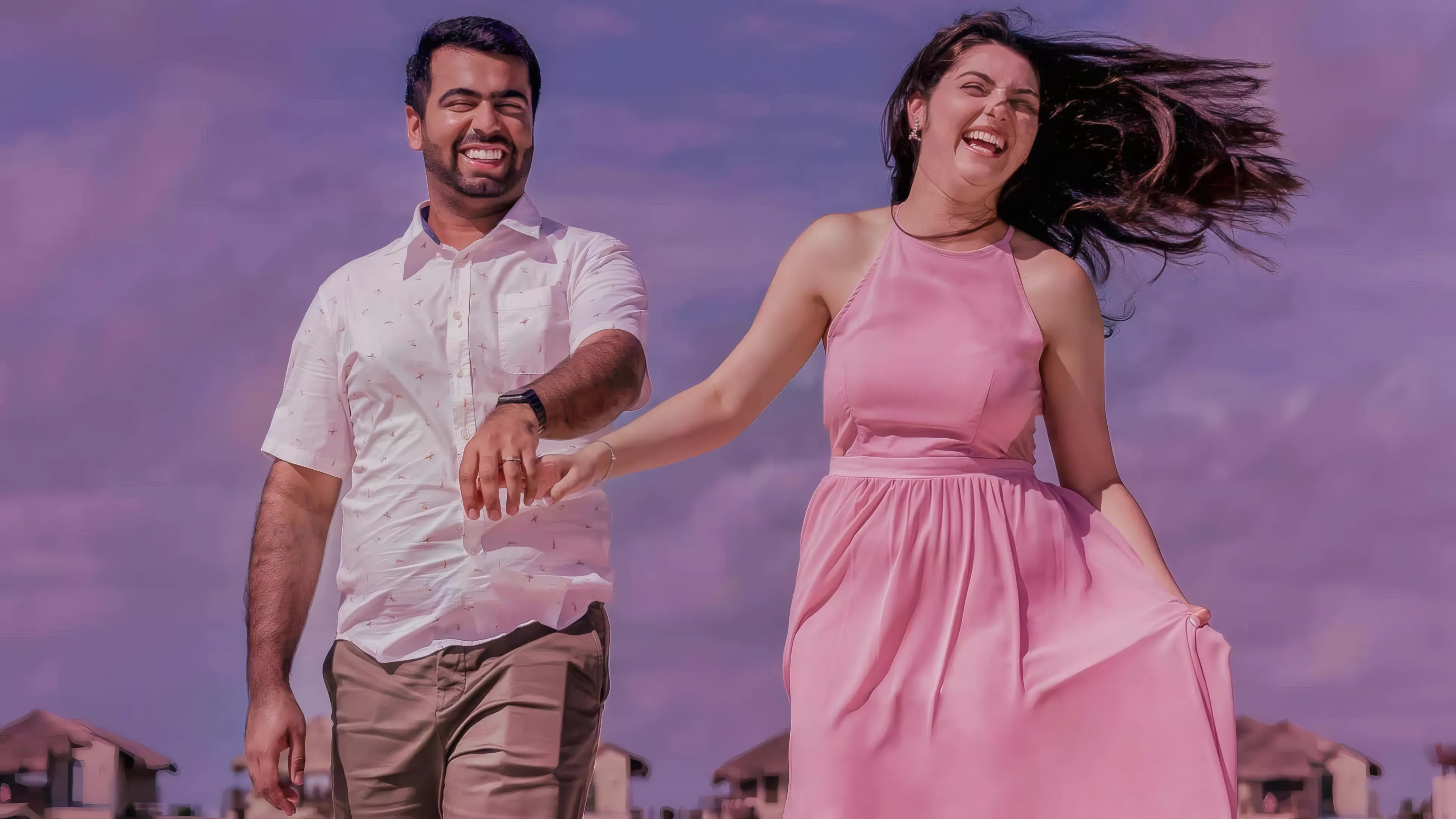 A couple laughing together during a Playa del Carmen portrait session